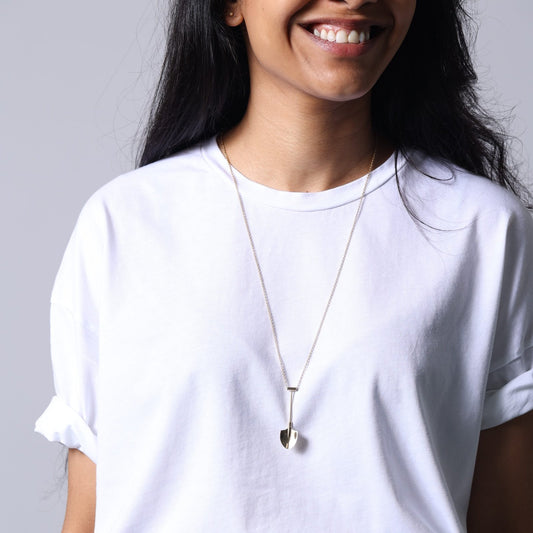 model wearing silver spoon necklace at a festival – Spade In Chelsea