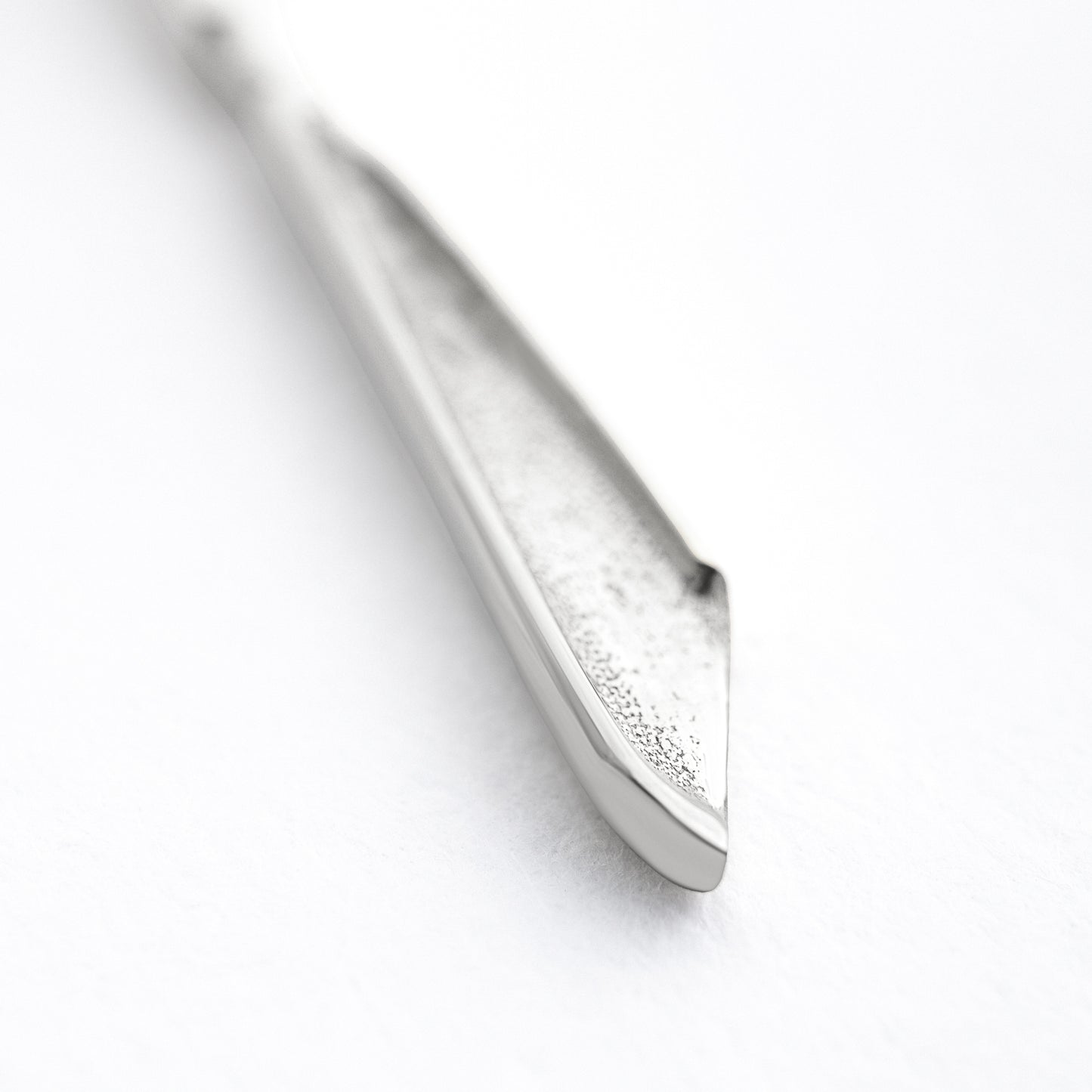 Scalpelle Silver worn – silver scalpel locket necklace on model spoon