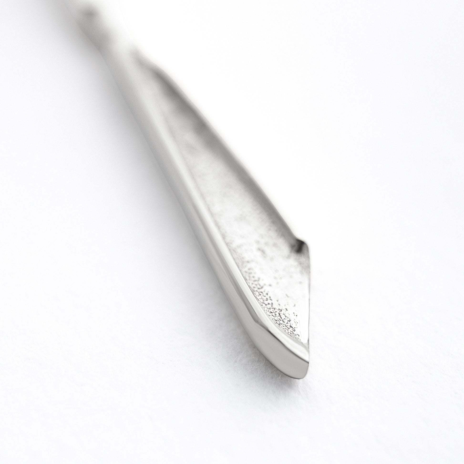 Scalpelle Silver worn – silver scalpel locket necklace on model spoon