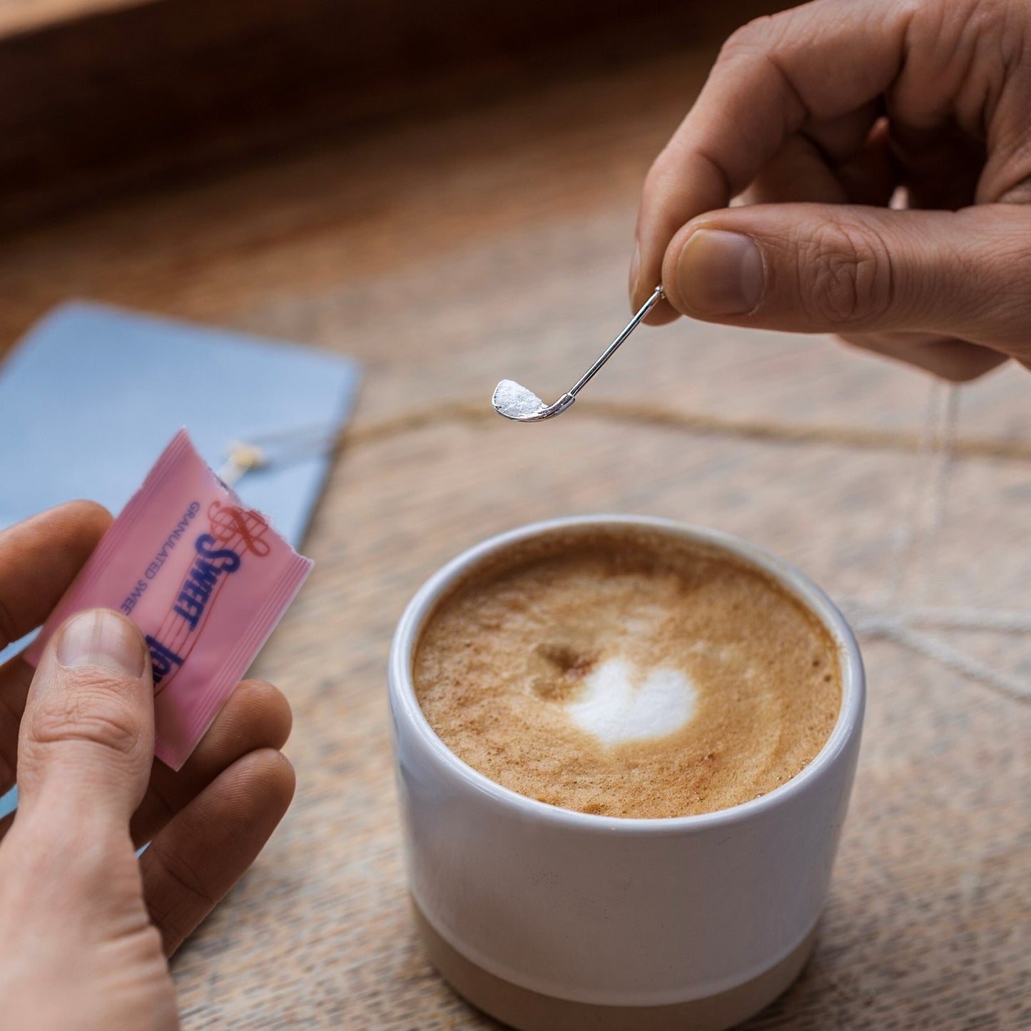 Who's Your Caddy Silver – lifestyle shot with coffee, golf jewelry