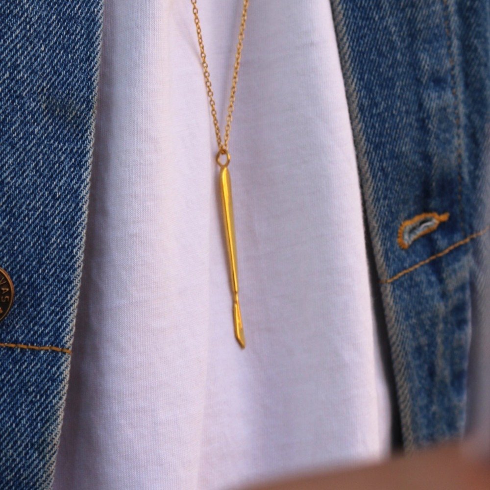 lifestyle shot of Scalpelle Gold – surgeon gift necklace