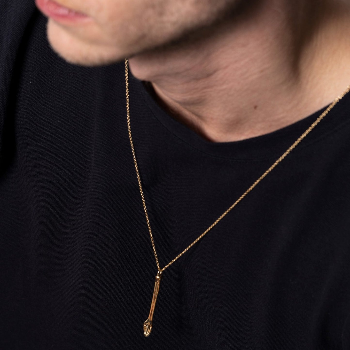 top-down view of The Anglesea Arm Gold – gold mini spoon hand pendant
