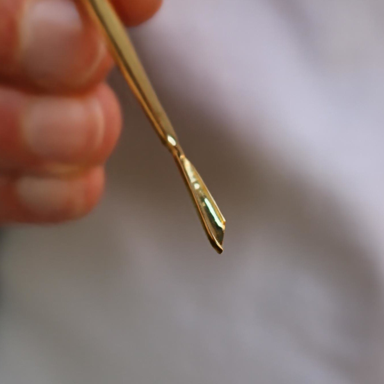 back view of gold surgeon necklace – Scalpelle Gold by Shovelle